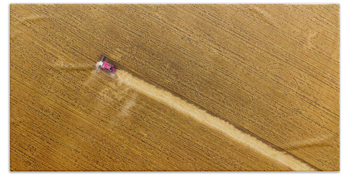Agriculture Hand Towel featuring the photograph Top view of combine on harvest field by Mikhail Kokhanchikov