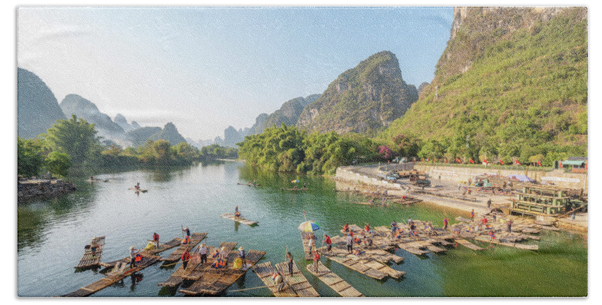 Adventure Hand Towel featuring the photograph Tourist bamboo rafts in Yangshuo Guilin by Philippe Lejeanvre