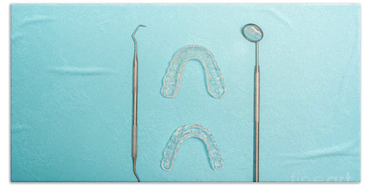 Adapted Hand Towel featuring the photograph Transparent dental aligner next to dentist mirror, copy space. by Joaquin Corbalan
