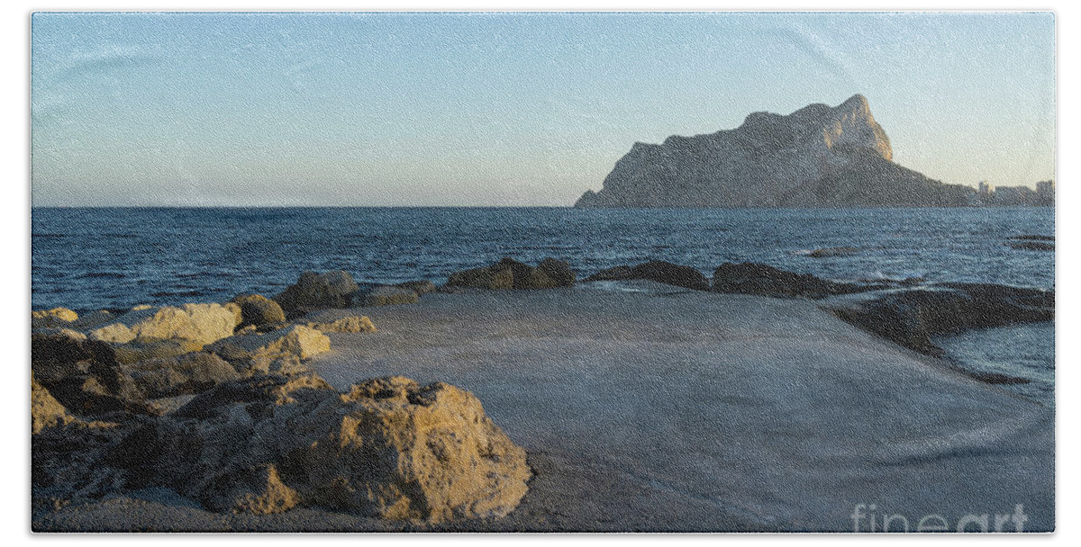 Mediterranean Coast Bath Towel featuring the photograph Warm evening light meets deep blue by Adriana Mueller