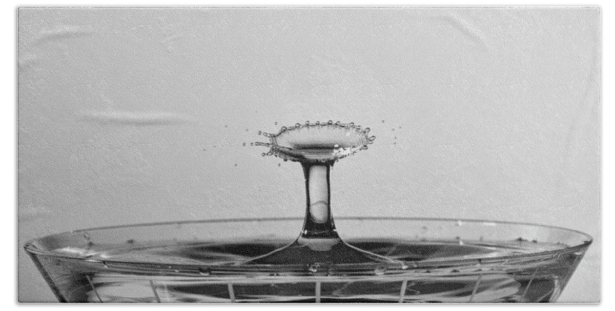 North Wilkesboro Hand Towel featuring the photograph Water Drops Collide Over Martini Glass Monochrome by Charles Floyd