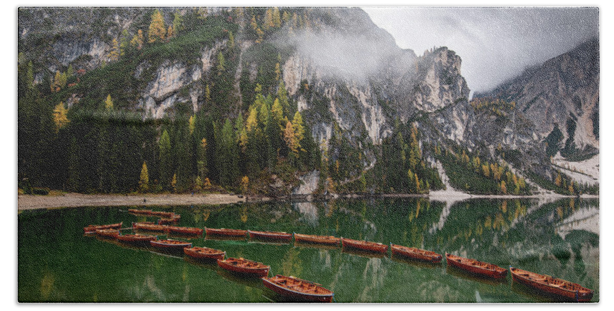 Lago Di Braies Bath Towel featuring the photograph Wooden boats on the peaceful lake. Lago di braies, Italy by Michalakis Ppalis