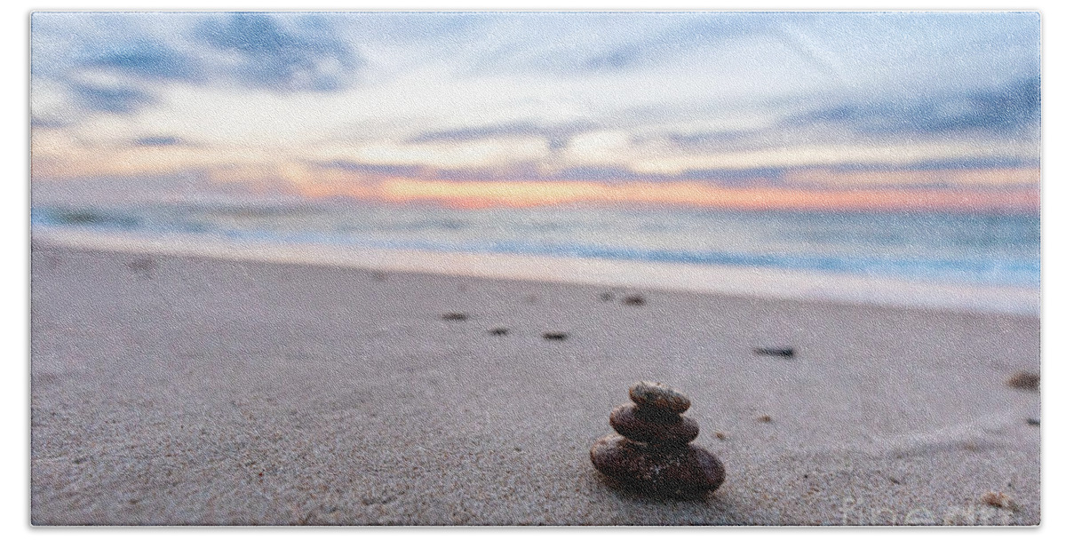 Zen Bath Towel featuring the photograph Zen stones on calm beach at sunset by Michal Bednarek