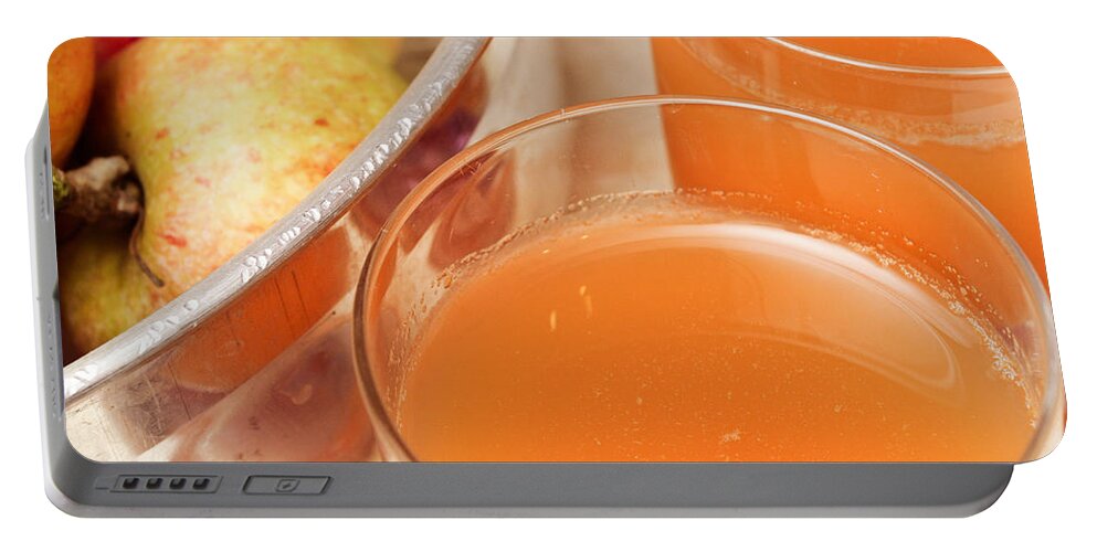 Apple Portable Battery Charger featuring the photograph Apple juice #1 by Tom Gowanlock