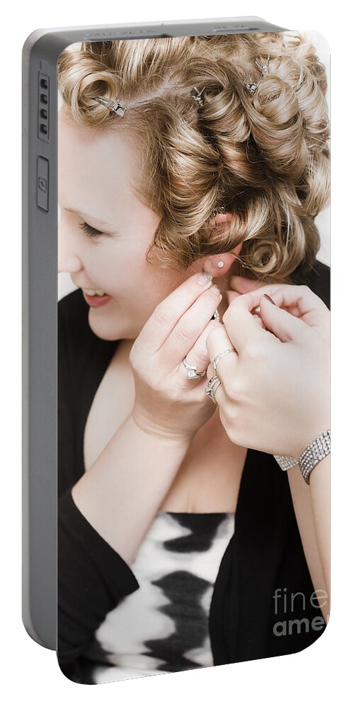 Woman Portable Battery Charger featuring the photograph Beautiful happy bride putting on earrings #1 by Jorgo Photography