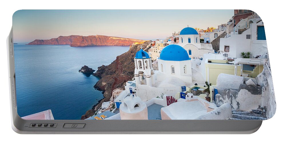 Santorini Portable Battery Charger featuring the photograph Beautiful village of Oia at sunrise - Santorini - Greece #1 by Matteo Colombo