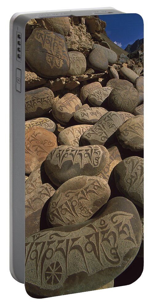 Feb0514 Portable Battery Charger featuring the photograph Carved Buddhist Mani Stones Zangla #1 by Colin Monteath