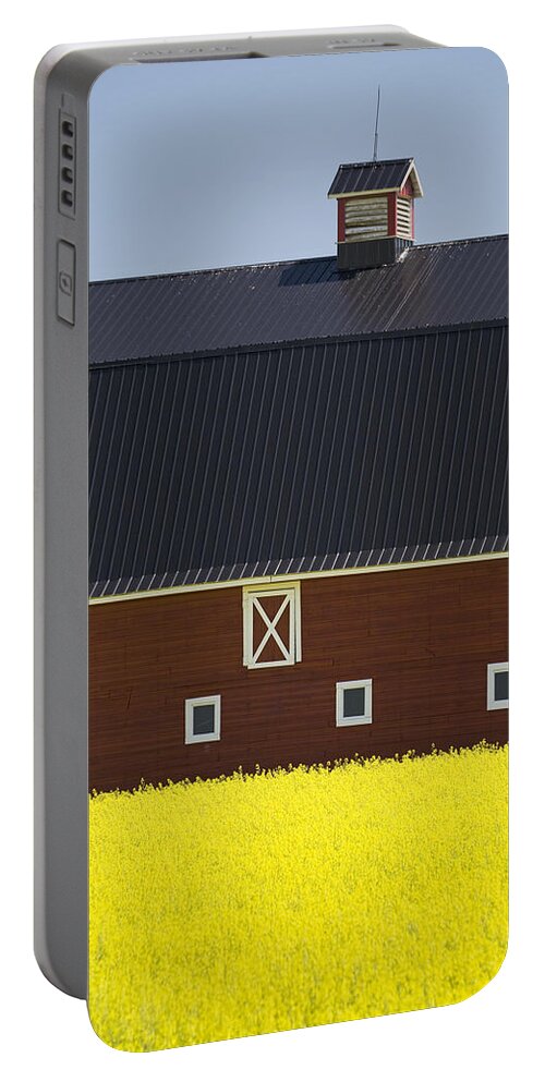 Agriculture Portable Battery Charger featuring the photograph Front Of A Red Barn In A Flowering #1 by Michael Interisano