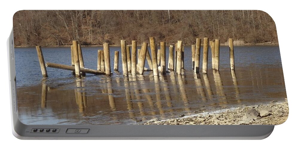 Water Portable Battery Charger featuring the photograph Frozen pilings #1 by Michael Porchik