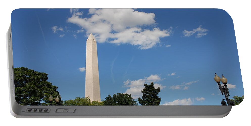 Washington Portable Battery Charger featuring the photograph Obelisk Rises Into the Clouds by Kenny Glover