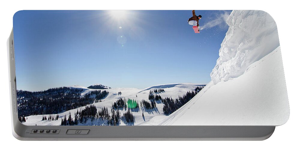 Young Adult Portable Battery Charger featuring the photograph Snowboarder Jumping #1 by Ben Girardi