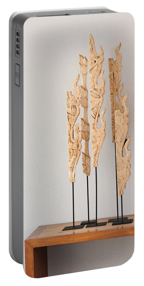 Apartment Portable Battery Charger featuring the photograph Wood sculpture #1 by U Schade