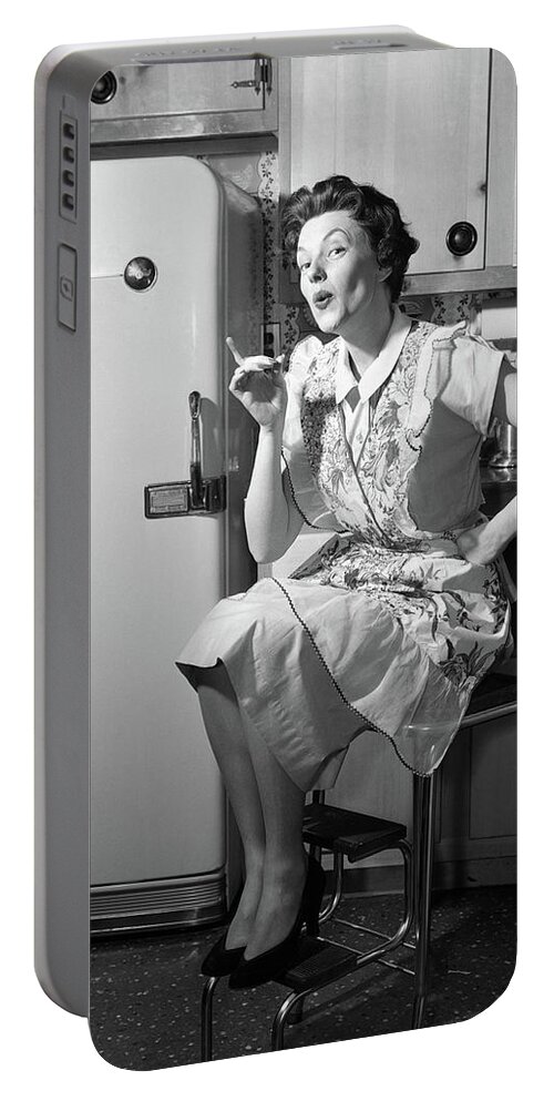 Photography Portable Battery Charger featuring the photograph 1950s Housewife Sitting On Stool by Vintage Images