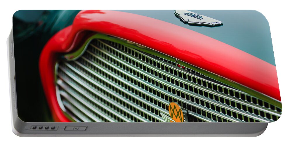 1960 Aston Martin Db4 Gt Coupe' Grille Emblem Portable Battery Charger featuring the photograph 1960 Aston Martin DB4 GT Coupe' Grille Emblem by Jill Reger