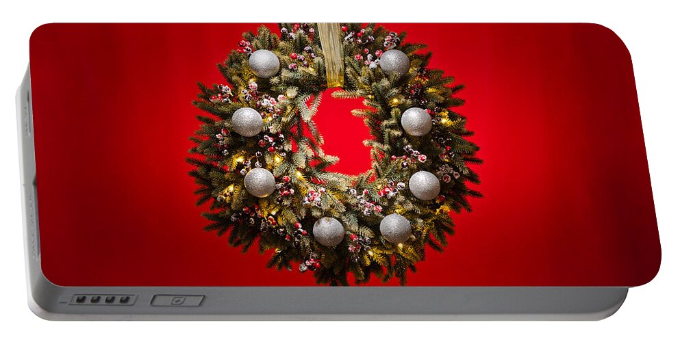 Advent Portable Battery Charger featuring the photograph Advent wreath over red background #2 by U Schade
