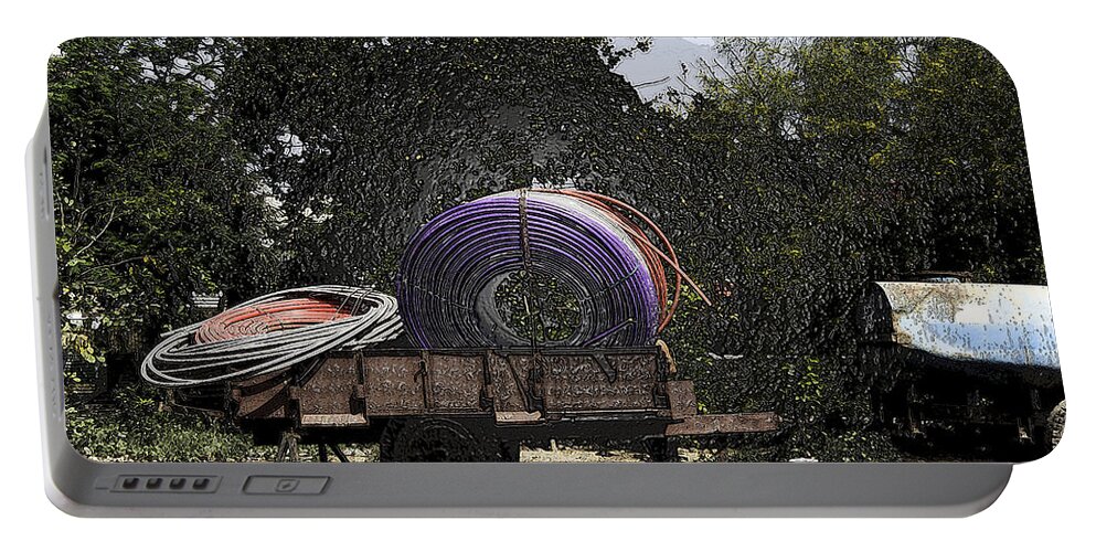 Canon Portable Battery Charger featuring the digital art Coils of thick plastic pipe on a carrier wagon #4 by Ashish Agarwal