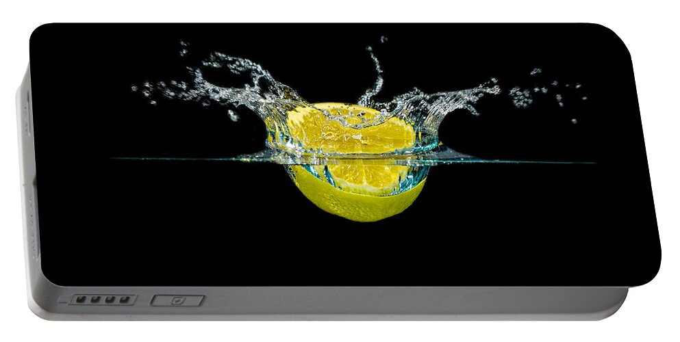 Beverage Portable Battery Charger featuring the photograph Splashing Lemon #4 by Peter Lakomy