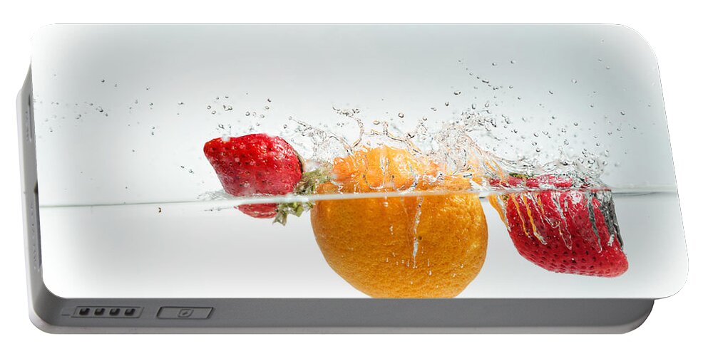 Aqua Portable Battery Charger featuring the photograph Splashing Fruits #5 by Peter Lakomy