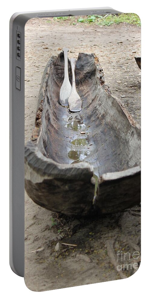Dugout Portable Battery Charger featuring the photograph A typical indigenous dugout by Jennifer E Doll