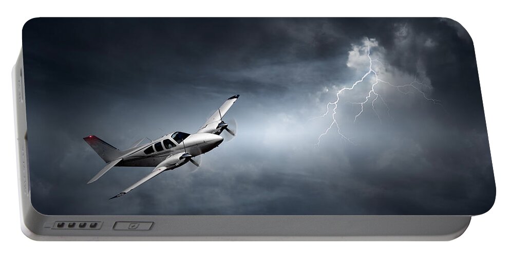 Aeroplane Portable Battery Charger featuring the photograph Risk - Aeroplane in thunderstorm by Johan Swanepoel