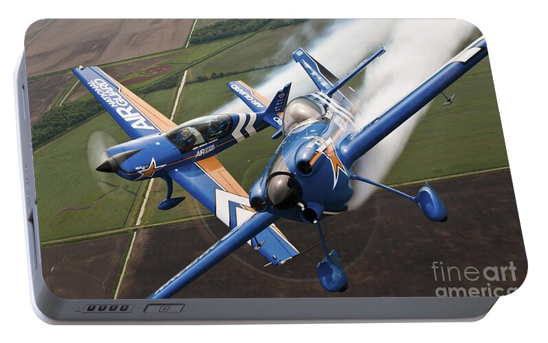 Military Portable Battery Charger featuring the photograph Airplanes Perform At The Sound Of Speed by Stocktrek Images