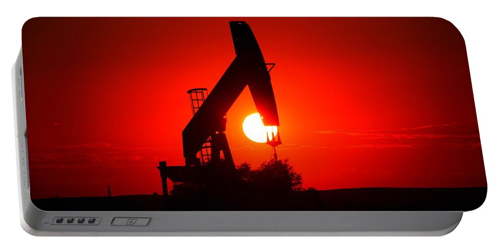 Sunset Portable Battery Charger featuring the photograph American Oil by Jeff Swan