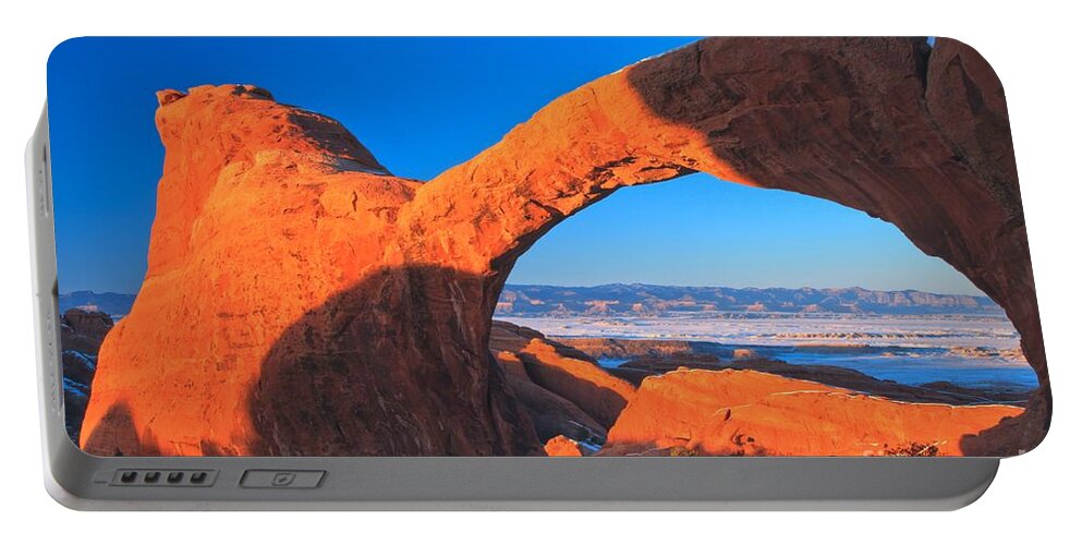 Double O Arch Portable Battery Charger featuring the photograph Arches Sunset Orange by Adam Jewell