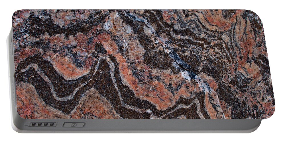 Banded Portable Battery Charger featuring the photograph Banded gneiss rock by Les Palenik