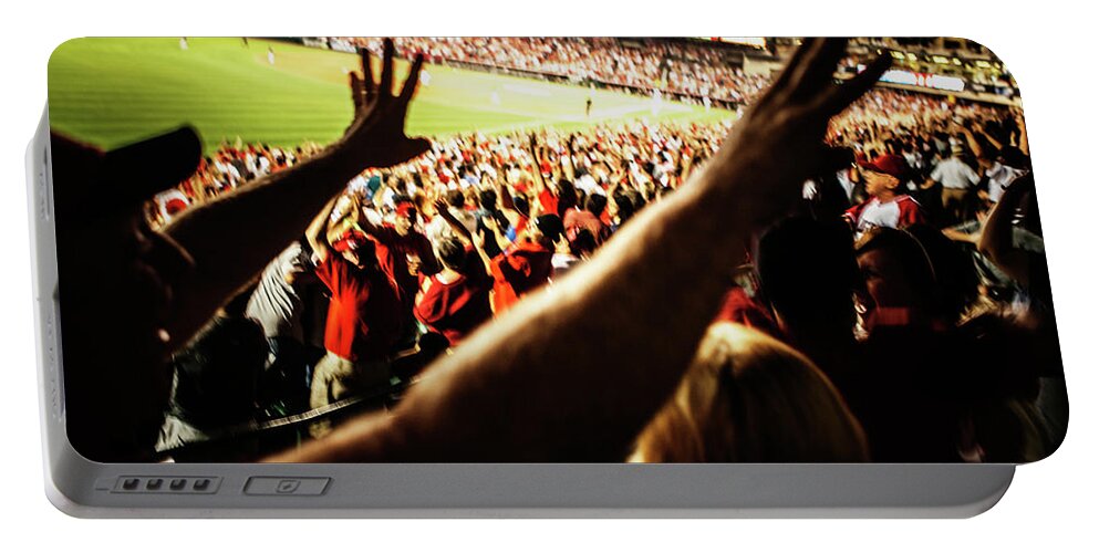 Anaheim Portable Battery Charger featuring the photograph Baseball Fans Raising Their Arms by Ron Koeberer