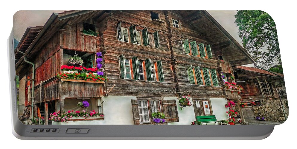 Switzerland Portable Battery Charger featuring the photograph Bernese wooden House by Hanny Heim