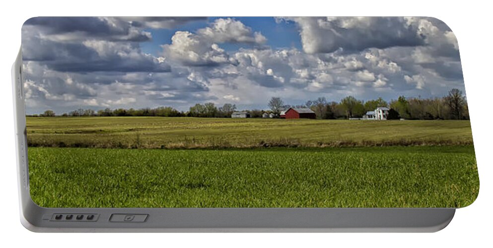 Field Portable Battery Charger featuring the photograph Billow Skies on Green by Bill and Linda Tiepelman