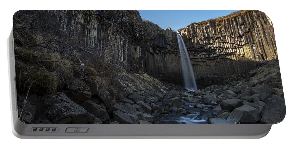 Waterfall Portable Battery Charger featuring the photograph Black Waterfall by Gunnar Orn Arnason