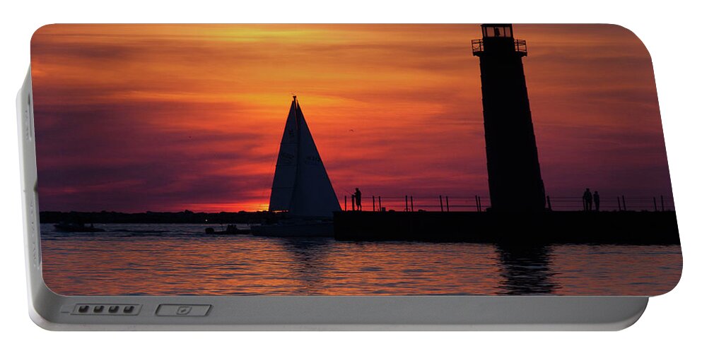 Nautical Portable Battery Charger featuring the photograph Boats entering the Channel at the Muskegon Lighthouse by John Harmon
