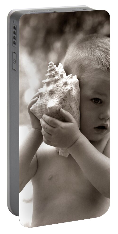 1960s Portable Battery Charger featuring the photograph Boy Holding Seashell To Ear, C.1960s by H Armstrong Roberts and ClassicStock