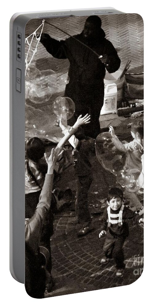 Central Park Portable Battery Charger featuring the photograph Bubbles and Kids - Central Park Sunday by Miriam Danar
