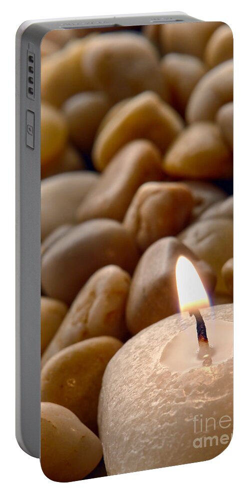 Candle Portable Battery Charger featuring the photograph Candle on the Rocks by Olivier Le Queinec