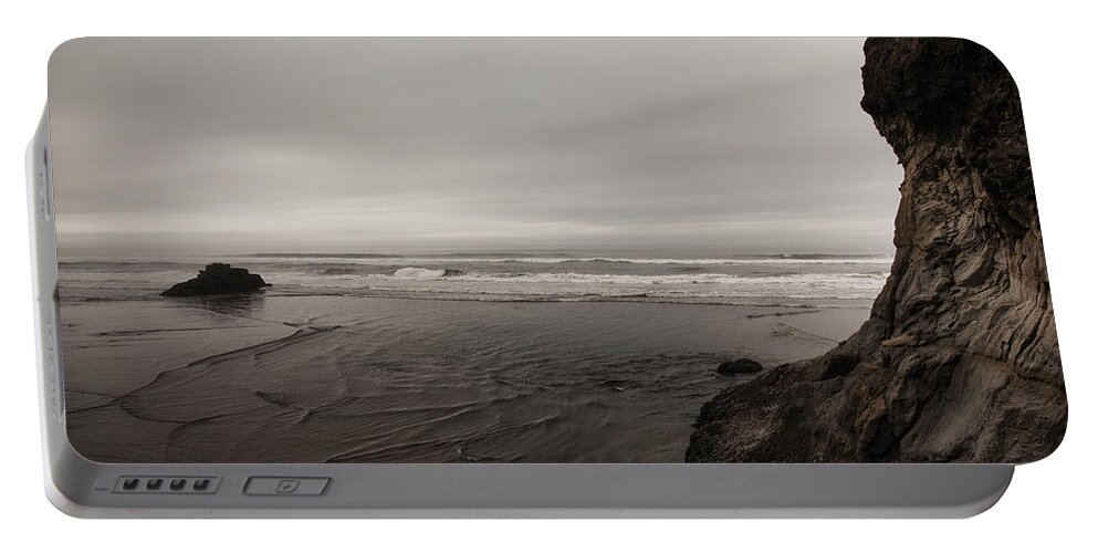 Rock Portable Battery Charger featuring the photograph Cannon Beach Places to Think 1 by Monte Arnold