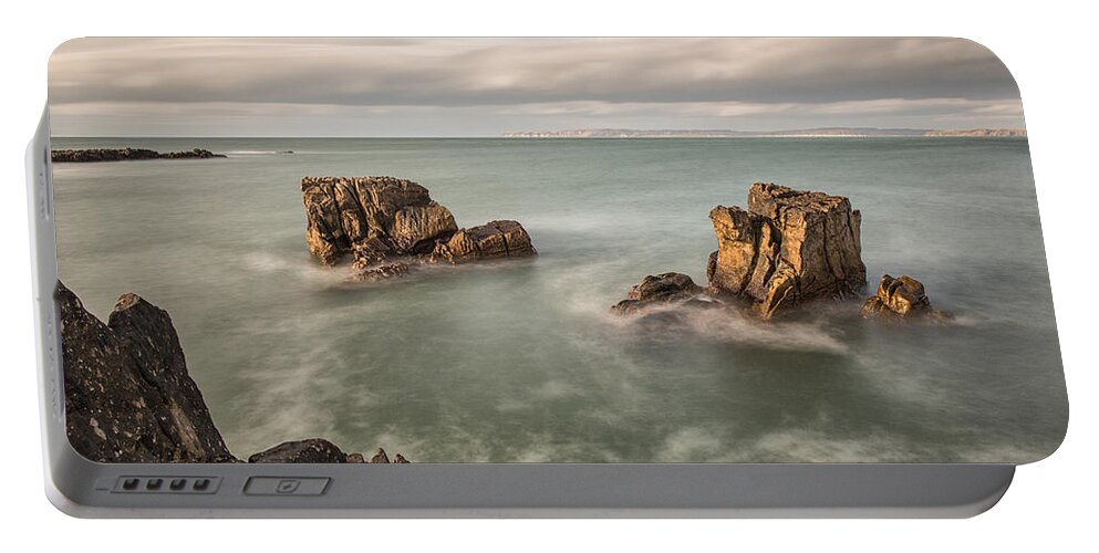 Pans Rock Portable Battery Charger featuring the photograph Ballycastle - Carved by the Sea by Nigel R Bell