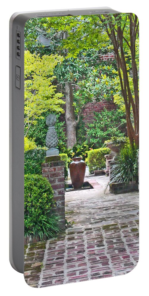 Charleston Portable Battery Charger featuring the photograph Charleston Welcome courtyard by Deborah Ferree