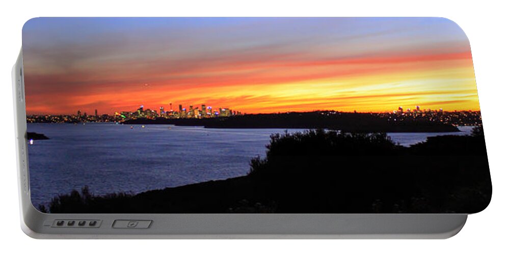 Sunset Portable Battery Charger featuring the photograph City lights in the sunset by Miroslava Jurcik
