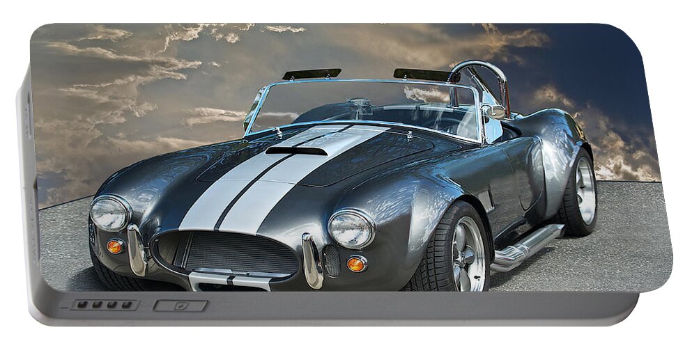 Auto Portable Battery Charger featuring the photograph Cobra in the Clouds by Dave Koontz