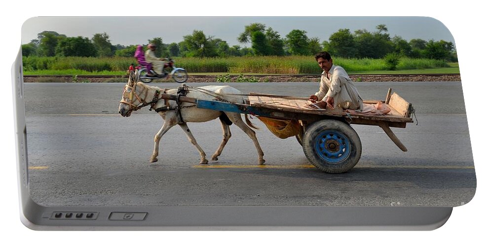 Donkey Portable Battery Charger featuring the photograph Donkey cart driver and motorcycle on Pakistan highway by Imran Ahmed