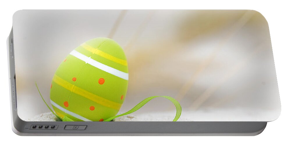 Easter Portable Battery Charger featuring the photograph Easter decorated egg on sand by Michal Bednarek