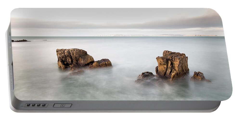 Pans Rock Portable Battery Charger featuring the photograph Ballycastle - Face in the Rock by Nigel R Bell