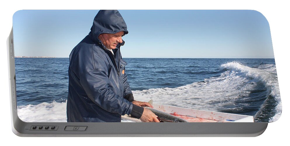 First Mate Filleting Fish Portable Battery Charger featuring the photograph First Mate Filleting Fish by John Telfer