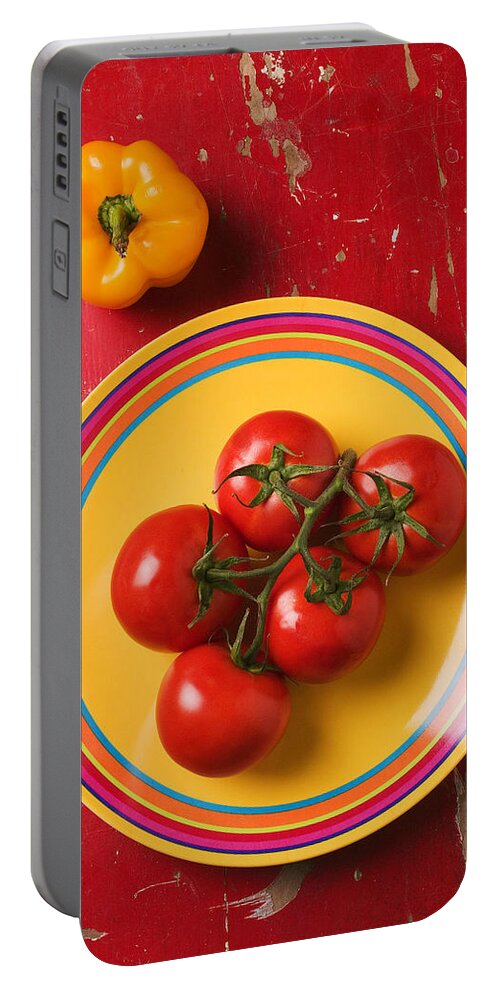 Five Portable Battery Charger featuring the photograph Five tomatoes on plate by Garry Gay