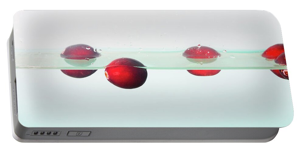Cranberries Portable Battery Charger featuring the photograph Floating Cranberries by Diane Macdonald