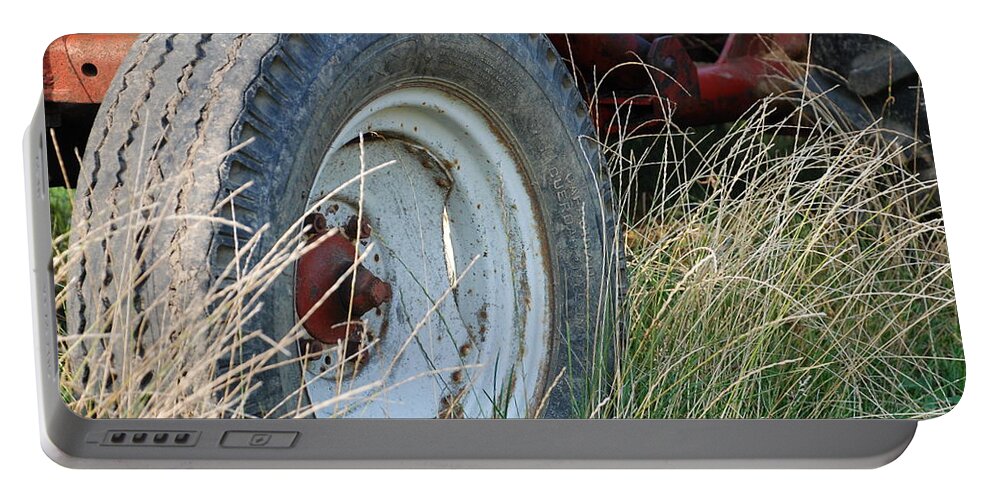 Ford Portable Battery Charger featuring the photograph Ford Tractor Tire by Jennifer Ancker