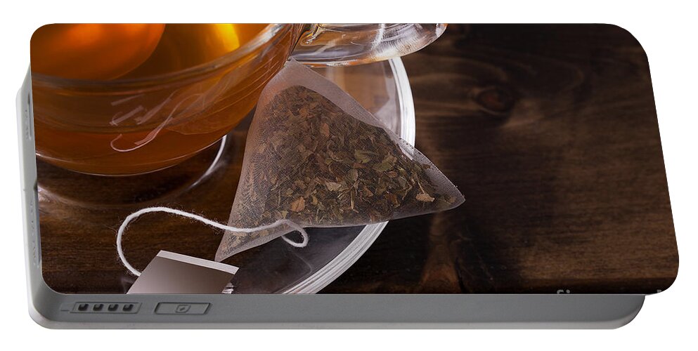 Tea Portable Battery Charger featuring the photograph Fresh glass cup of tea by Simon Bratt