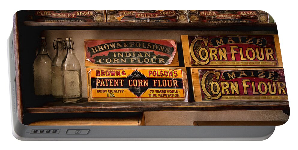 Tin Portable Battery Charger featuring the photograph General Store 2 by Nigel R Bell